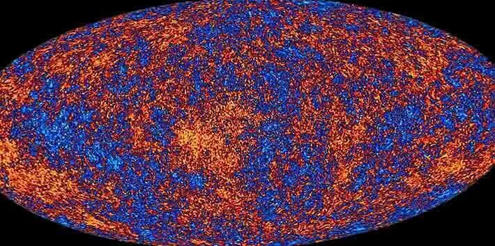 Neste mapa da radiação cósmica de fundo em micro-ondas, as cores representam as pequenas flutuações de temperatura do brilho remanescente do universo em sua infância as regiões vermelhas são mais quentes e as azuis, mais frias.