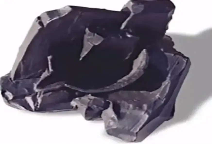 Impressão de uma tigela num fragmento de carvão.